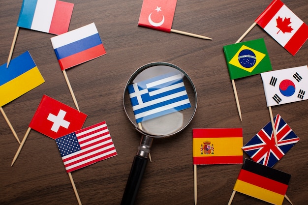 Free photo close up on small greece flag under magnifying glass
