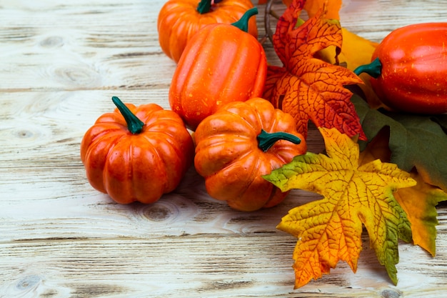 Close-up small pumpkins with wooden background