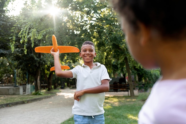 Close up smiley boy with plane