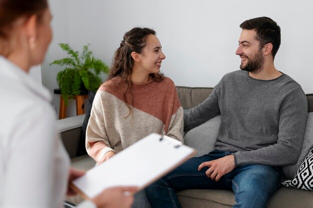 close up smiley couple in therapy