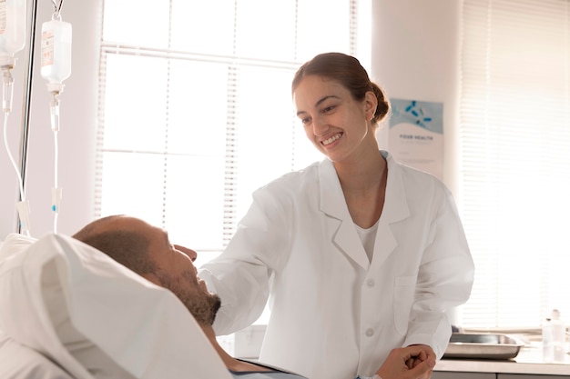 Close up smiley doctor checking patient