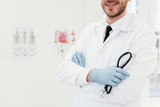 Close-up smiley doctor with stethoscope