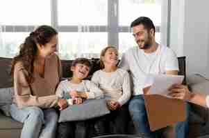 Free photo close up smiley family at therapy