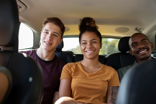 Close up smiley friends in car