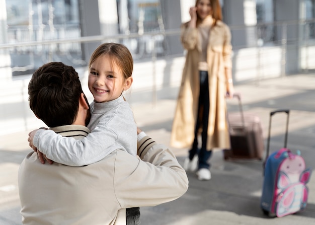 Close up smiley girl hugging father