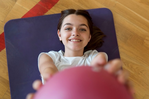 Close up smiley girl with ball