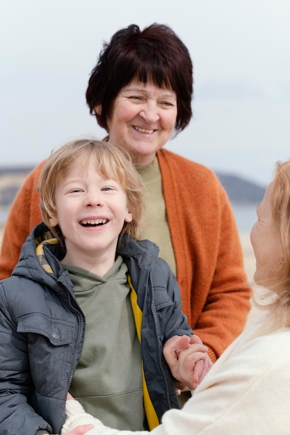 Free photo close up smiley kid and women