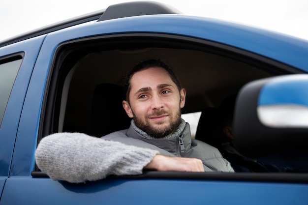 Close up smiley man in car