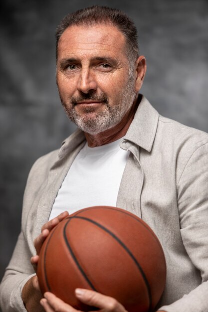 Close up smiley man holding ball