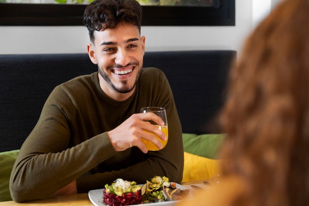 Close up smiley man holding glass