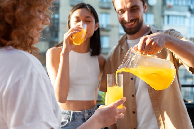 Close up smiley man pouring drink