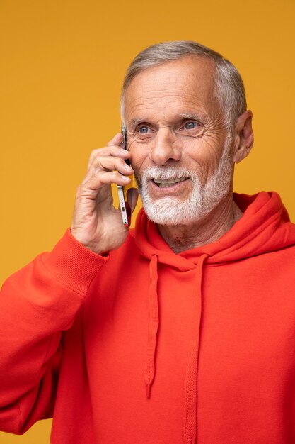 Close up smiley man talking on phone