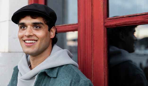 Close up smiley man wearing hat