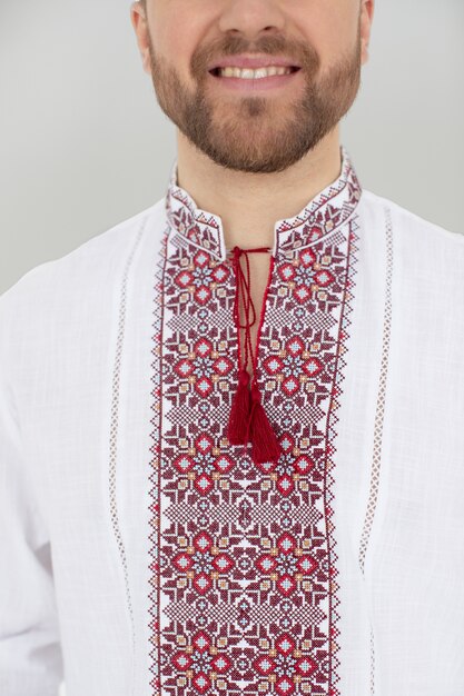close up smiley man wearing traditional shirt