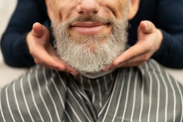 Close up smiley man with beautiful beard