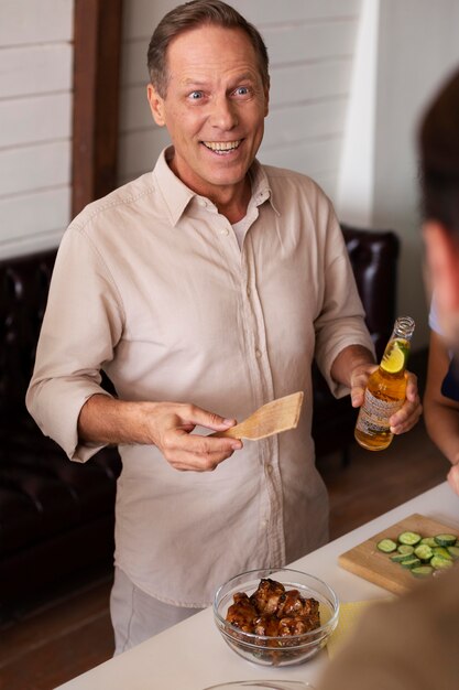 close up smiley man with food