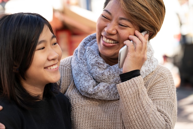 Free photo close up smiley mother and girl