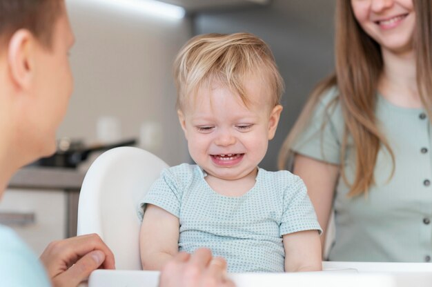 Close up smiley parents with toddler