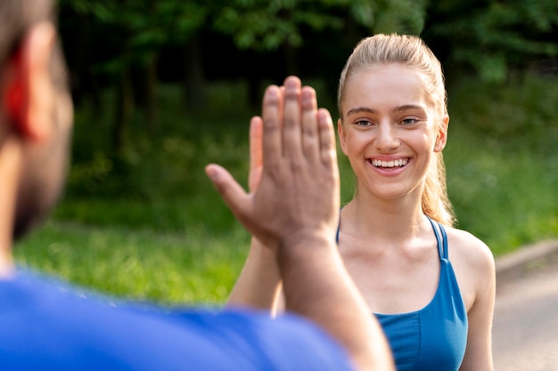 Close up smiley people high five