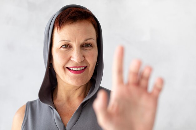 Close-up smiley senior woman looking at camera