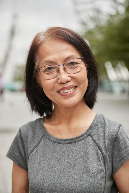 Close up smiley senior woman outdoors