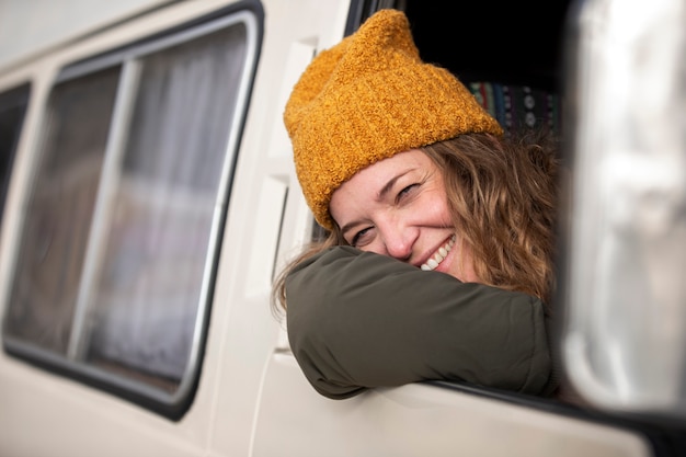 Close up smiley woman in campervan