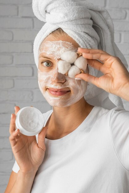 Close-up smiley woman holding cotton