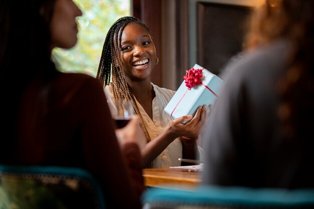 Close up smiley woman holding gift