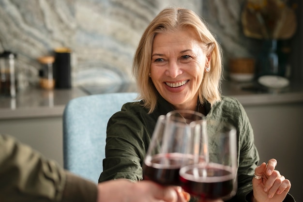 Close up smiley woman holding glass