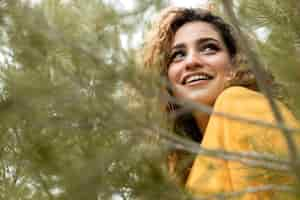 Free photo close up smiley woman in nature