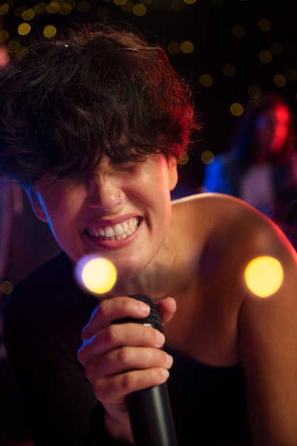 Close up smiley woman singing