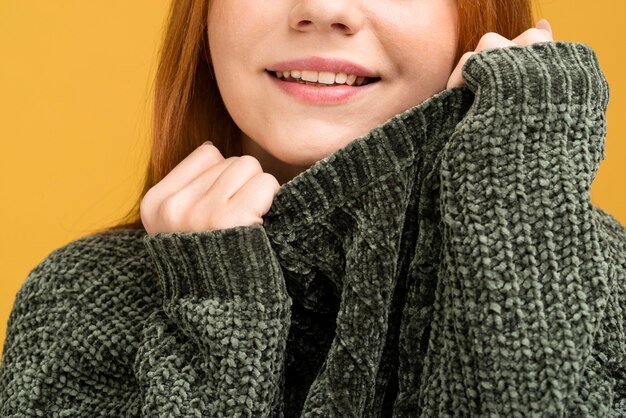 Close-up smiley woman in sweater