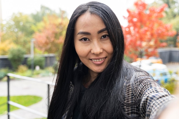 Close-up smiley woman taking selfie