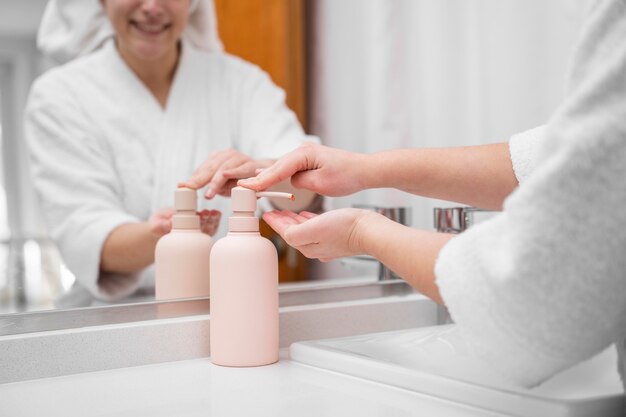 Close-up smiley woman using soap