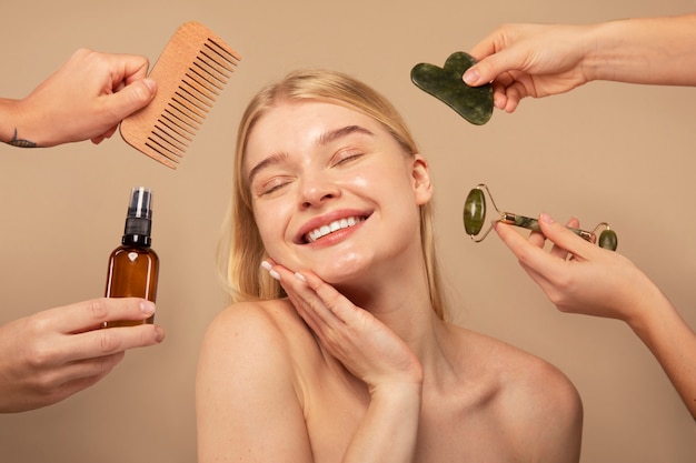 Close up smiley woman with beauty tools