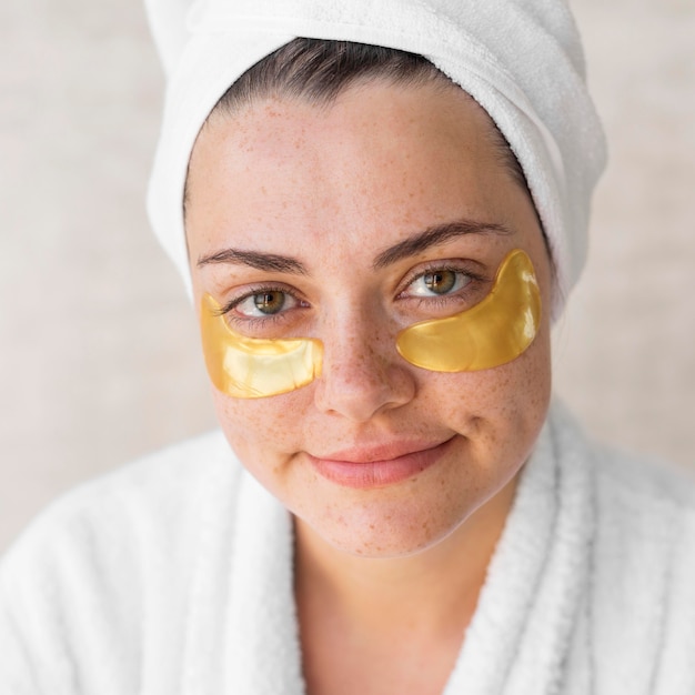 Close-up smiley woman with eye patches