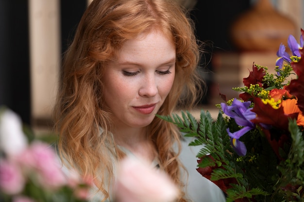 Close up smiley woman with flowers