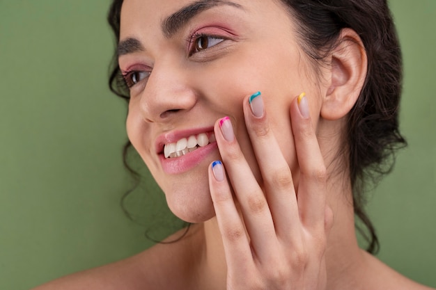 Close up smiley woman with french manicure