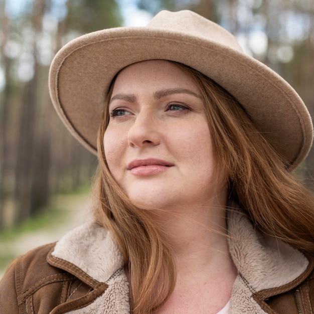 Close up smiley woman with hat