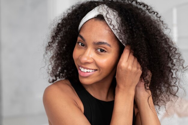 Close up smiley woman with headband