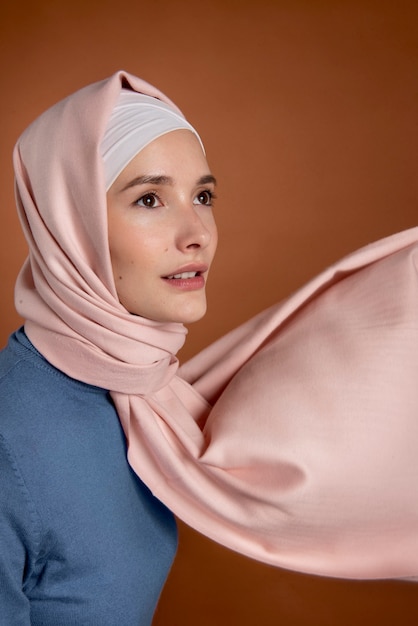 Free photo close up smiley woman with hijab