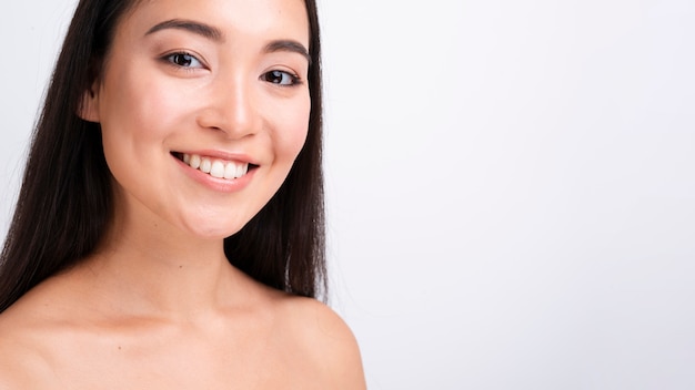 Free photo close-up smiley woman with long hair and copy-space