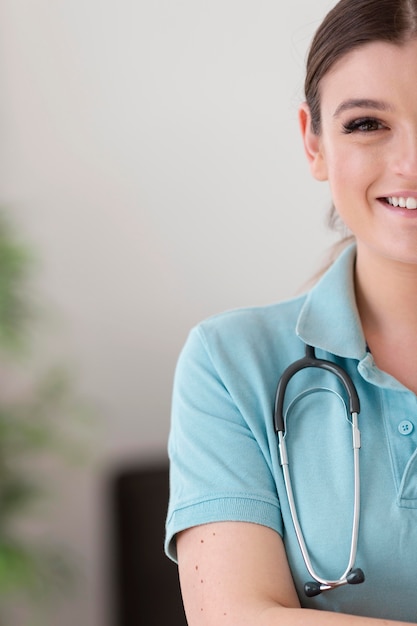 Free photo close up smiley woman with stethoscope