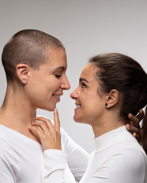 Close up smiley women looking at each other