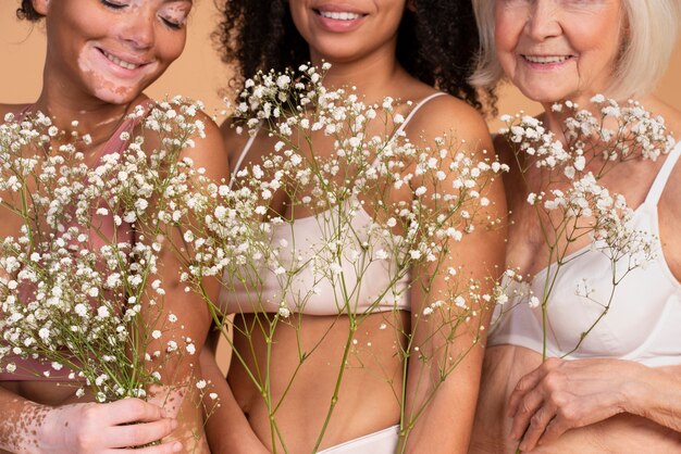 Close up smiley women with flowers