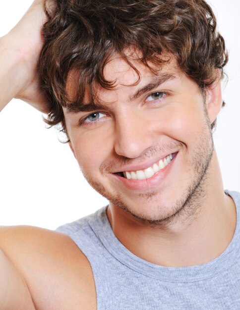 Close-up smiling face of a beautiful caucasian man
