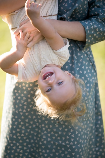 Close-up of smiling girl having fun with her mother