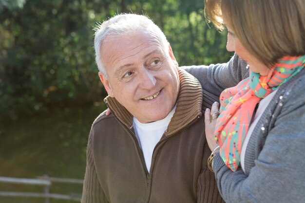 Close-up of smiling husband looking at his wife