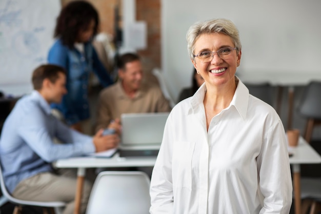 Free photo close up on smiling person in conference room