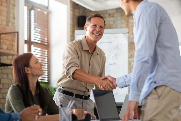 Close up on smiling person in conference room